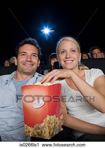 A couple watching a movie View Large Photo Image Stock Image - A couple watching a movie. Fotosearch