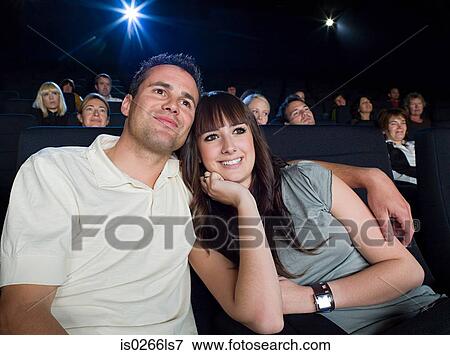 A couple watching a movie View Large Photo Image Stock Photo - A couple watching a movie. Fotosearch