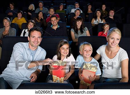A family watching a movie View Large Photo Image Stock Image - A family watching a movie. Fotosearch