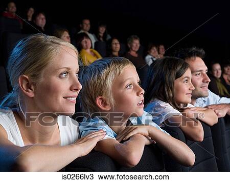 A family watching a movie View Large Photo Image Stock Image - A family watching a movie. Fotosearch