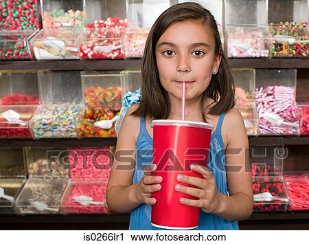 A girl drinking a soft drink View Large Photo Image Stock Image - A girl drinking a soft drink. Fotosearch