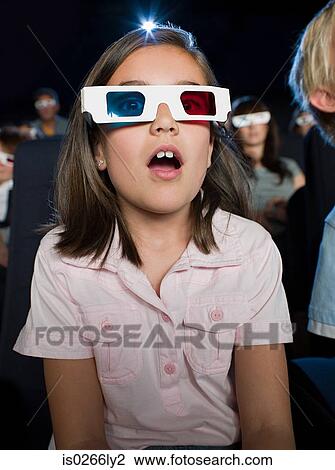 A girl watching a 3d movie View Large Photo Image Stock Image - A girl watching a 3d movie. Fotosearch