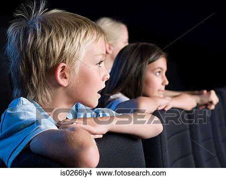 Children watching a movie View Large Photo Image Picture - Children watching a movie. Fotosearch