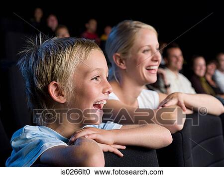 Mother and son watching a movie View Large Photo Image Stock Image - Mother and son watching a movie. Fotosearch