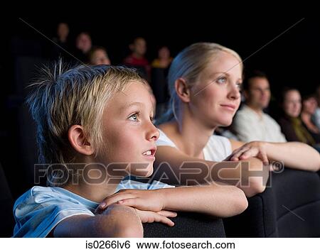Mother and son watching a movie View Large Photo Image Stock Photograph - Mother and son watching a movie. Fotosearch