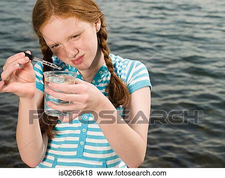 A girl doing an experiment View Large Photo Image Stock Photo - A girl doing an experiment. Fotosearch