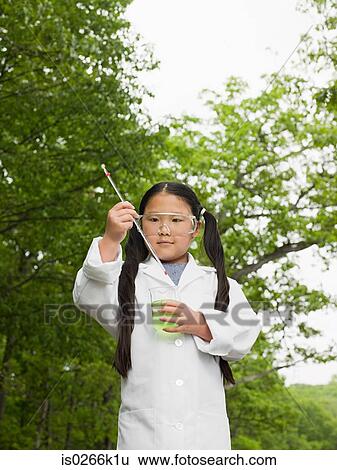 A girl doing an experiment View Large Photo Image Stock Photograph - A girl doing an experiment. Fotosearch