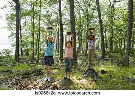 Portrait of friends holding blackboards View Large Photo Image Stock Photography - Portrait of friends holding blackboards. Fotosearch