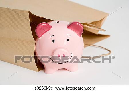 Piggy bank and a paper bag View Large Photo Image Stock Image - Piggy bank and a paper bag. Fotosearch