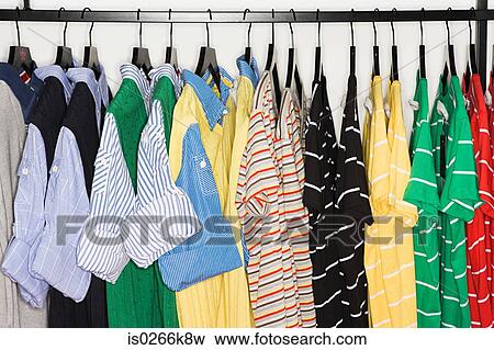 Stock Photo - T-shirts on a clothes rail. Fotosearch