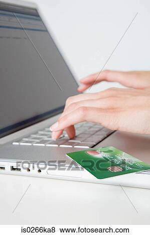 Woman shopping online View Large Photo Image Stock Photo - Woman shopping online. Fotosearch