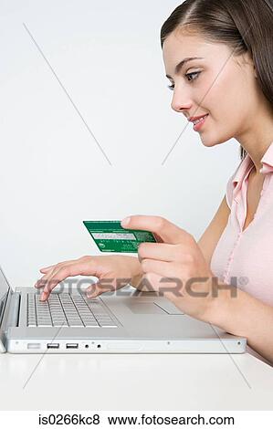 Woman shopping online View Large Photo Image Stock Photo - Woman shopping online. Fotosearch