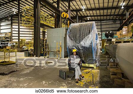 Businesswoman in warehouse View Large Photo Image Stock Photography - Businesswoman in warehouse. Fotosearch