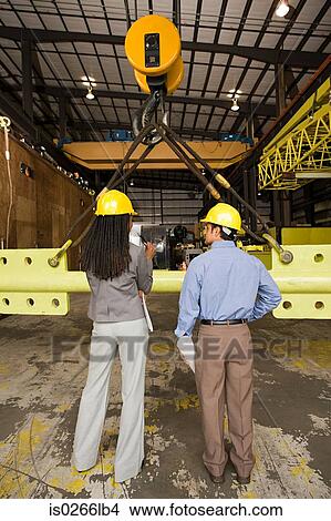 Colleagues in warehouse View Large Photo Image Picture - Colleagues in warehouse. Fotosearch