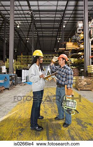 Colleagues in warehouse View Large Photo Image Picture - Colleagues in warehouse. Fotosearch