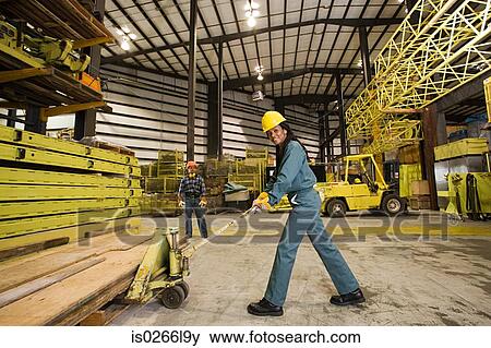 Stock Photo - Colleagues in warehouse. Fotosearch