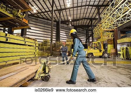 Colleagues in warehouse View Large Photo Image Stock Photo - Colleagues in warehouse. Fotosearch