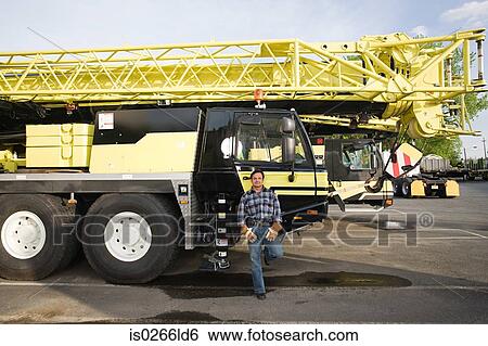 Man with crane truck View Large Photo Image Stock Photograph - Man with crane truck. Fotosearch