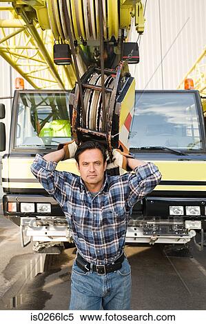Man with crane truck View Large Photo Image Stock Photography - Man with crane truck. Fotosearch