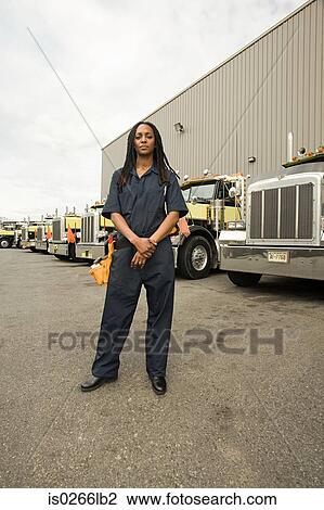 Worker by trucks View Large Photo Image Stock Image - Worker by trucks. Fotosearch
