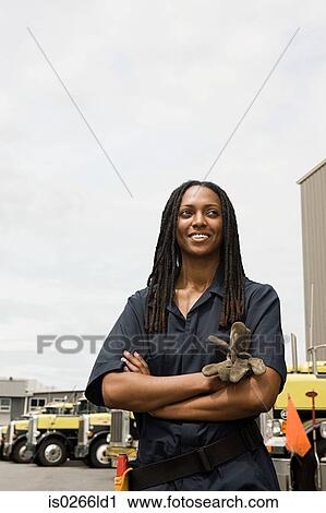 Worker by trucks View Large Photo Image Stock Image - Worker by trucks. Fotosearch