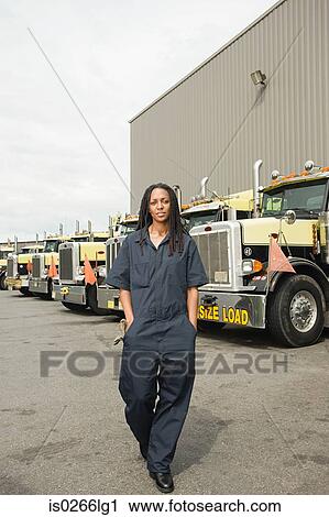 Worker by trucks View Large Photo Image Stock Image - Worker by trucks. Fotosearch
