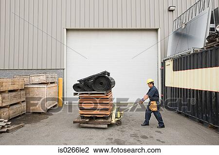 Worker in loading bay View Large Photo Image Stock Image - Worker in loading bay. Fotosearch
