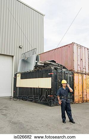 Stock Image - Worker in loading bay. Fotosearch