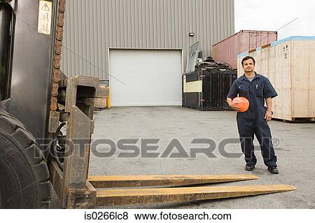 Worker in loading bay View Large Photo Image Stock Photo - Worker in loading bay. Fotosearch