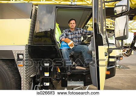 Worker in truck View Large Photo Image Stock Image - Worker in truck. Fotosearch