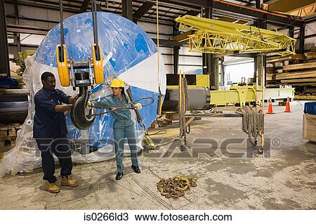 Workers in warehouse View Large Photo Image Stock Image - Workers in warehouse. Fotosearch