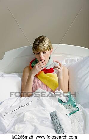 A woman in bed with a cold View Large Photo Image Stock Photo - A woman in bed with a cold. Fotosearch