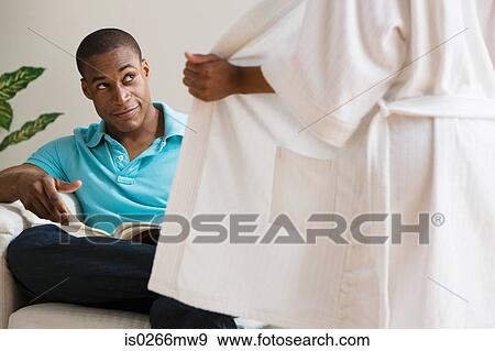 Stock Photo - A woman seducing a man . Fotosearch