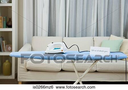 An iron and ironing board View Large Photo Image Stock Photograph - An iron and ironing board. Fotosearch