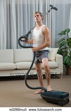 Portrait of a man with a vacuum cleaner View Large Photo Image Stock Photography - Portrait of a man with a vacuum cleaner. Fotosearch