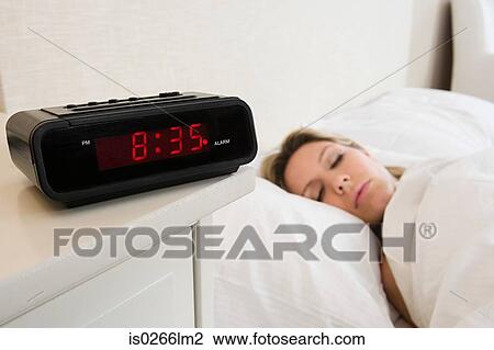 Woman asleep in bed View Large Photo Image Stock Image - Woman asleep in bed. Fotosearch