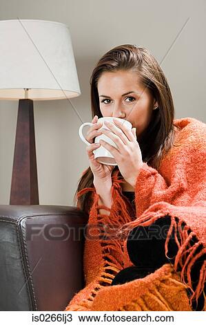 Woman with hot drink and blanket View Large Photo Image Stock Image - Woman with hot drink and blanket. Fotosearch