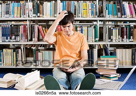 Confused student in library View Large Photo Image Stock Image - Confused student in library. Fotosearch