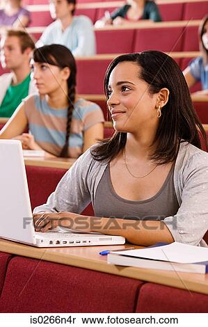 Stock Photography - Female student in lecture. Fotosearch