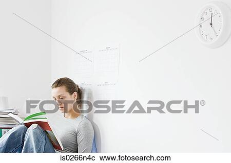 Student reading in room View Large Photo Image Stock Image - Student reading in room. Fotosearch