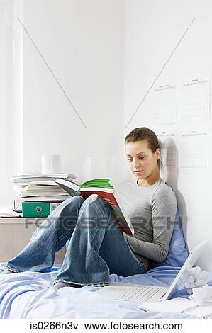 Student reading in room View Large Photo Image Stock Photo - Student reading in room. Fotosearch