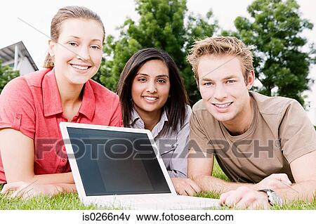 Stock Photo - Students working outdoors. Fotosearch
