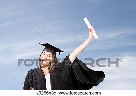 Stock Image - Young woman graduating. Fotosearch