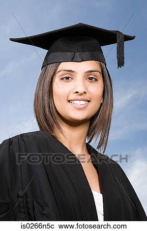 Stock Image - Young woman graduating. Fotosearch