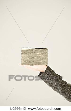 A person holding a pile of dollars View Large Photo Image Stock Image - A person holding a pile of dollars. Fotosearch
