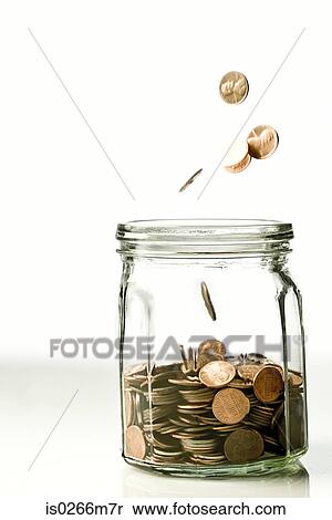 Coins in a jar View Large Photo Image Stock Photography - Coins in a jar. Fotosearch