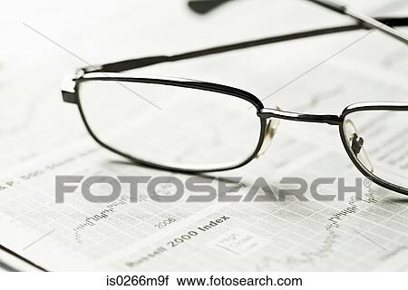 Glasses and a newspaper View Large Photo Image Stock Image - Glasses and a newspaper. Fotosearch