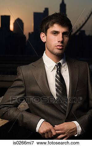 Stock Photo - Businessman at sunset. Fotosearch