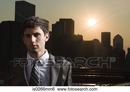 Businessman at sunset View Large Photo Image Stock Photograph - Businessman at sunset. Fotosearch