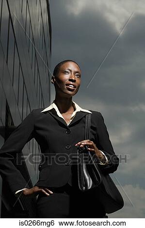 Businesswoman and a cloudy sky View Large Photo Image Stock Photograph - Businesswoman and a cloudy sky. Fotosearch